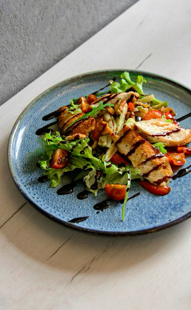 Colorful chicken salad in a restaurant setting