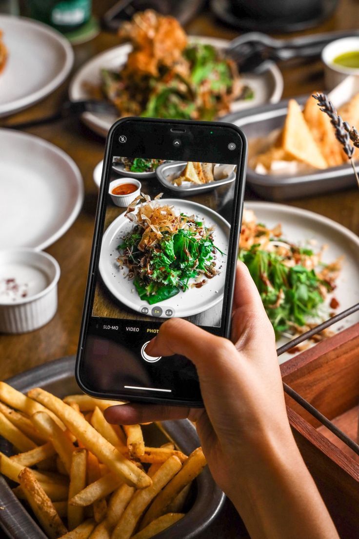 Capturing a salad on camera at a restaurant