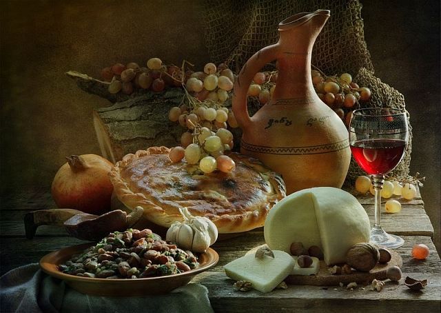 Rustic still life with wine, cheese and bread