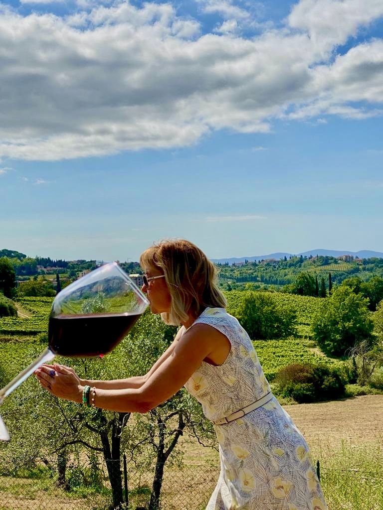 Two glasses of wine overlooking rolling hills